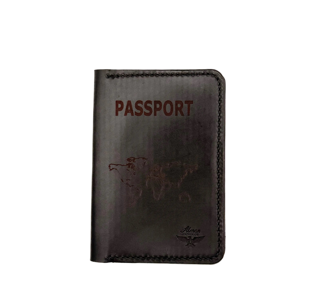 Black leather passport holder with 'PASSPORT' text on a light gray background