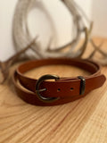 Brown leather belt with a brass buckle