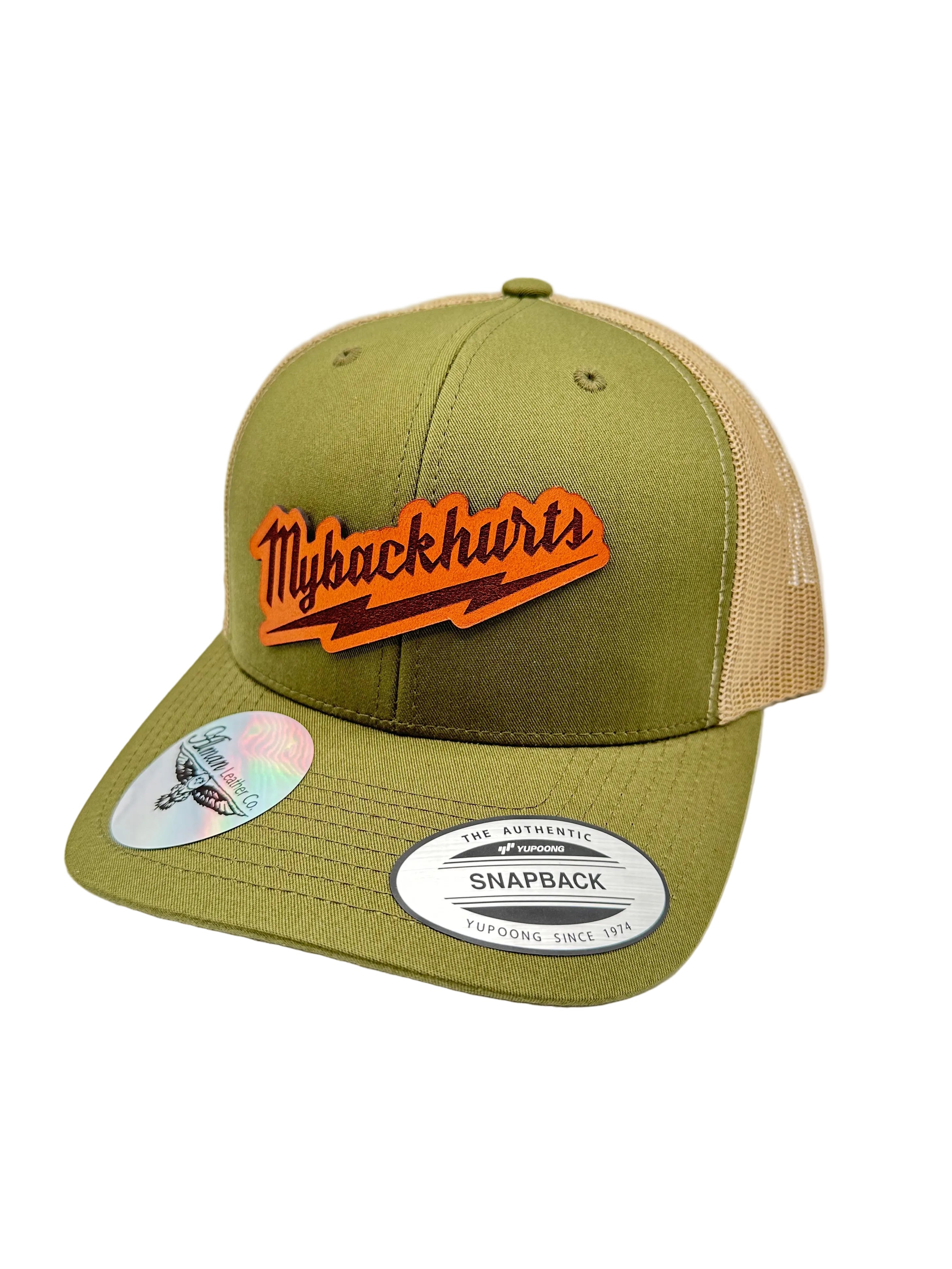 Green trucker cap with leather logo on a white background
