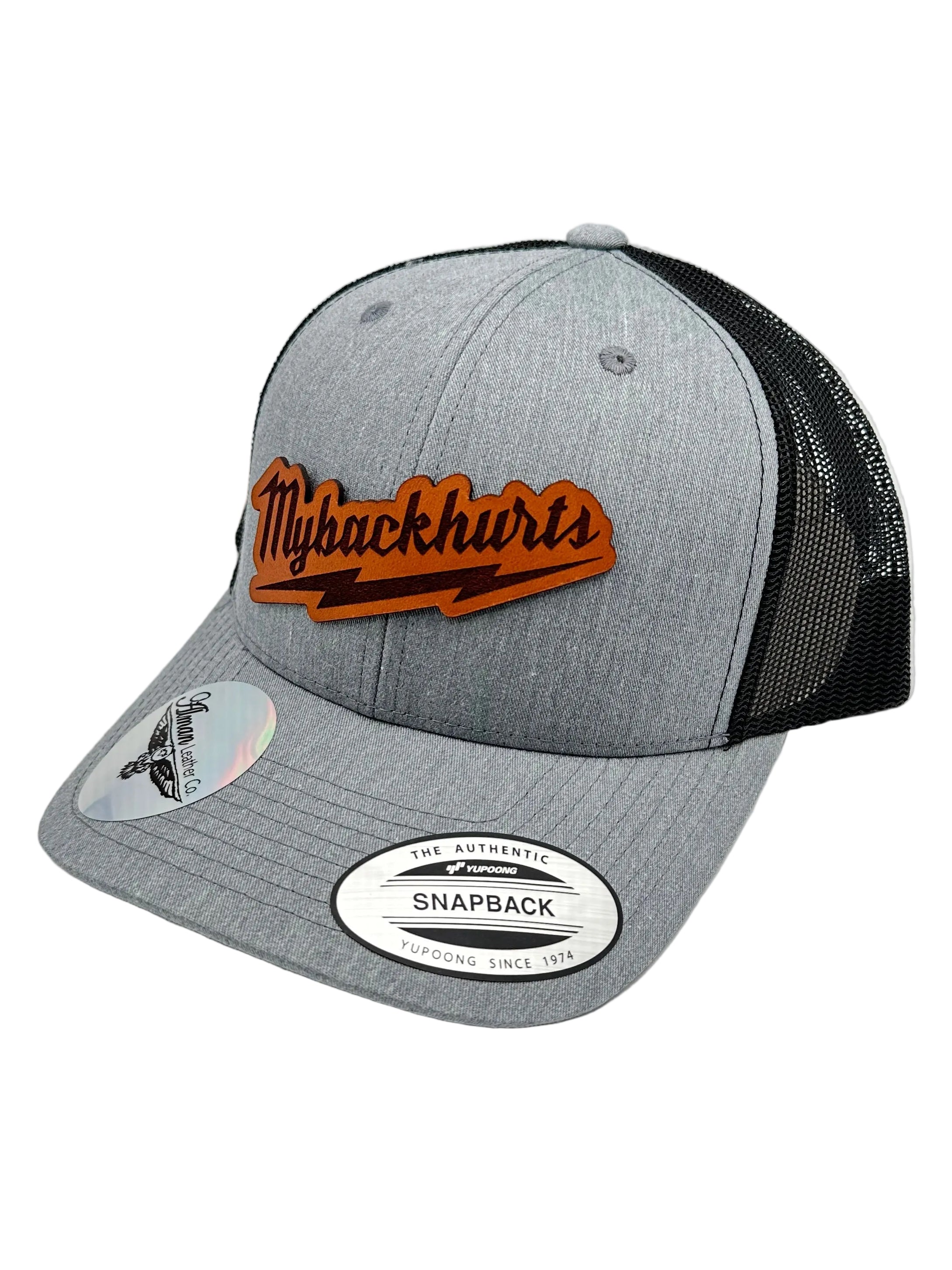 Gray truvker hat with leather patch 