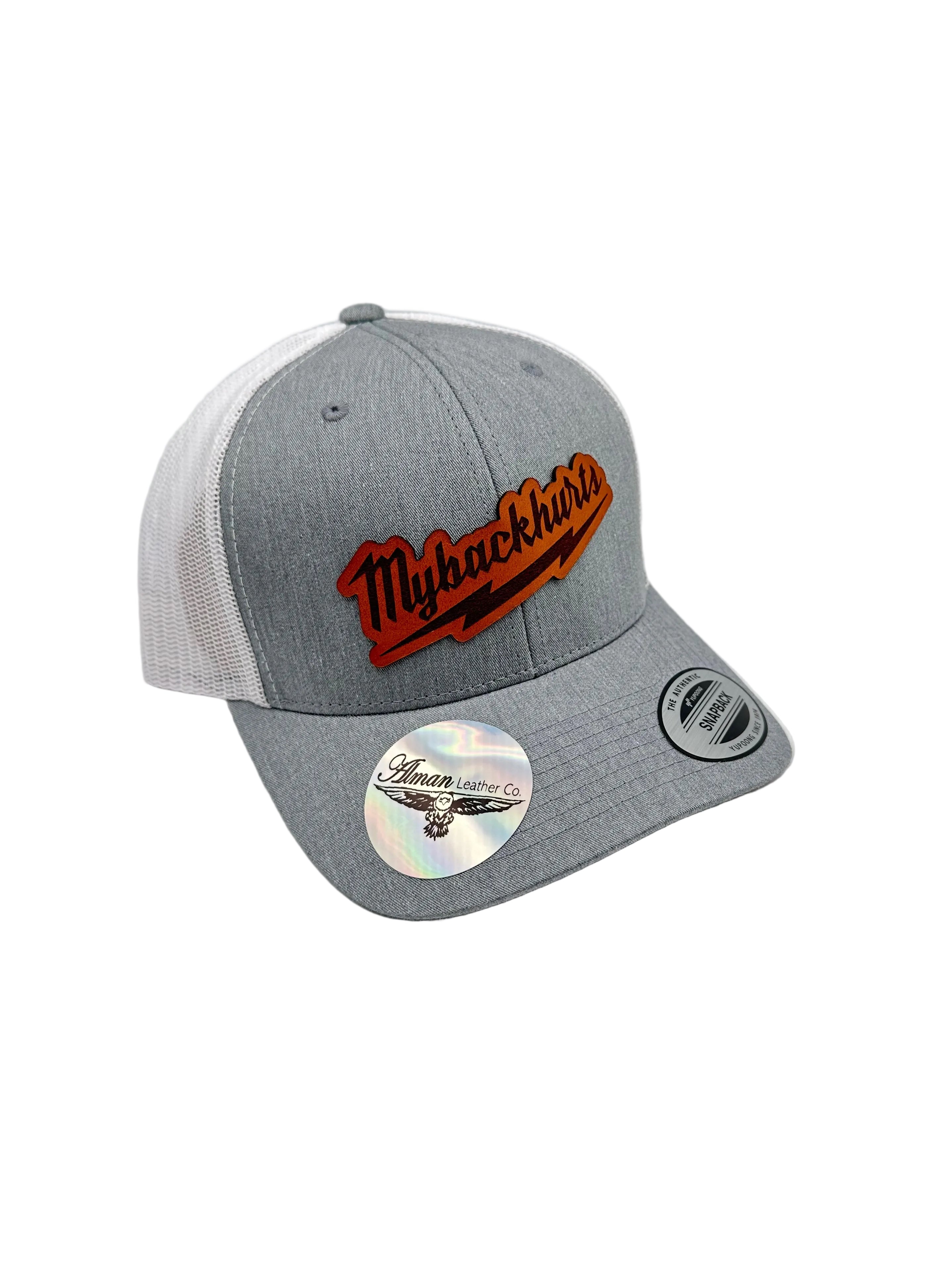 Gray cap with embroidered logo and mountain design on a light gray background